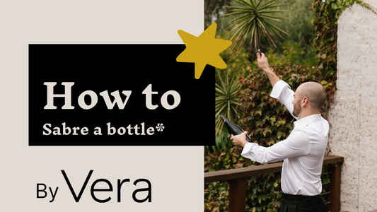 Josh sabreing a bottle of Laherte Freres Champagne